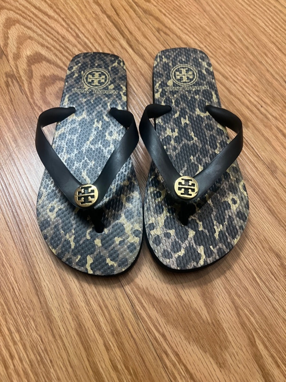 Tory Burch Black Strappy Flip Flops with Leopard Print Footbed and Gold Logo